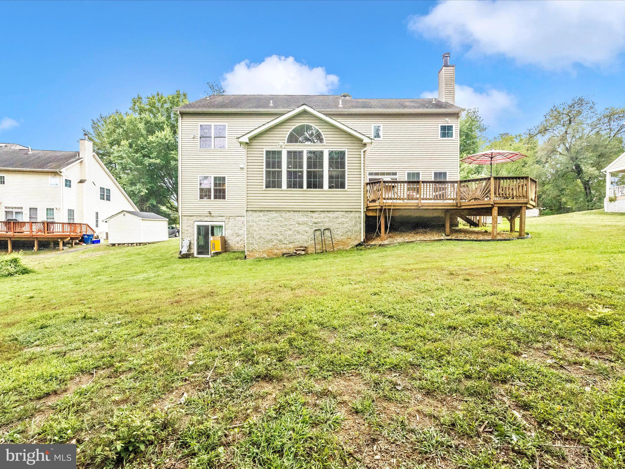 18818 Liberty Mill Road Germantown, MD 20874 - Photo 31 of 39 a view of a house with a yard table and chairs