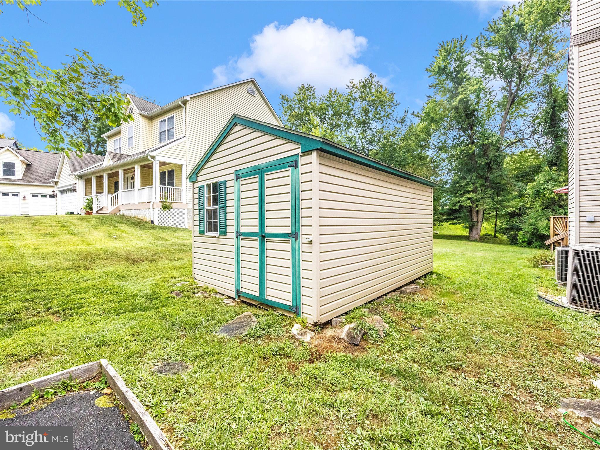 18818 Liberty Mill Road Germantown, MD 20874 - Photo 33 of 39 a view of a house with a yard
