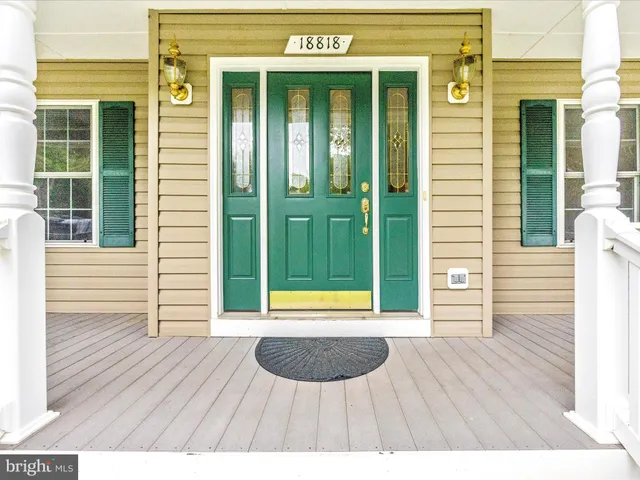 a view of a door of a house with an outdoor space