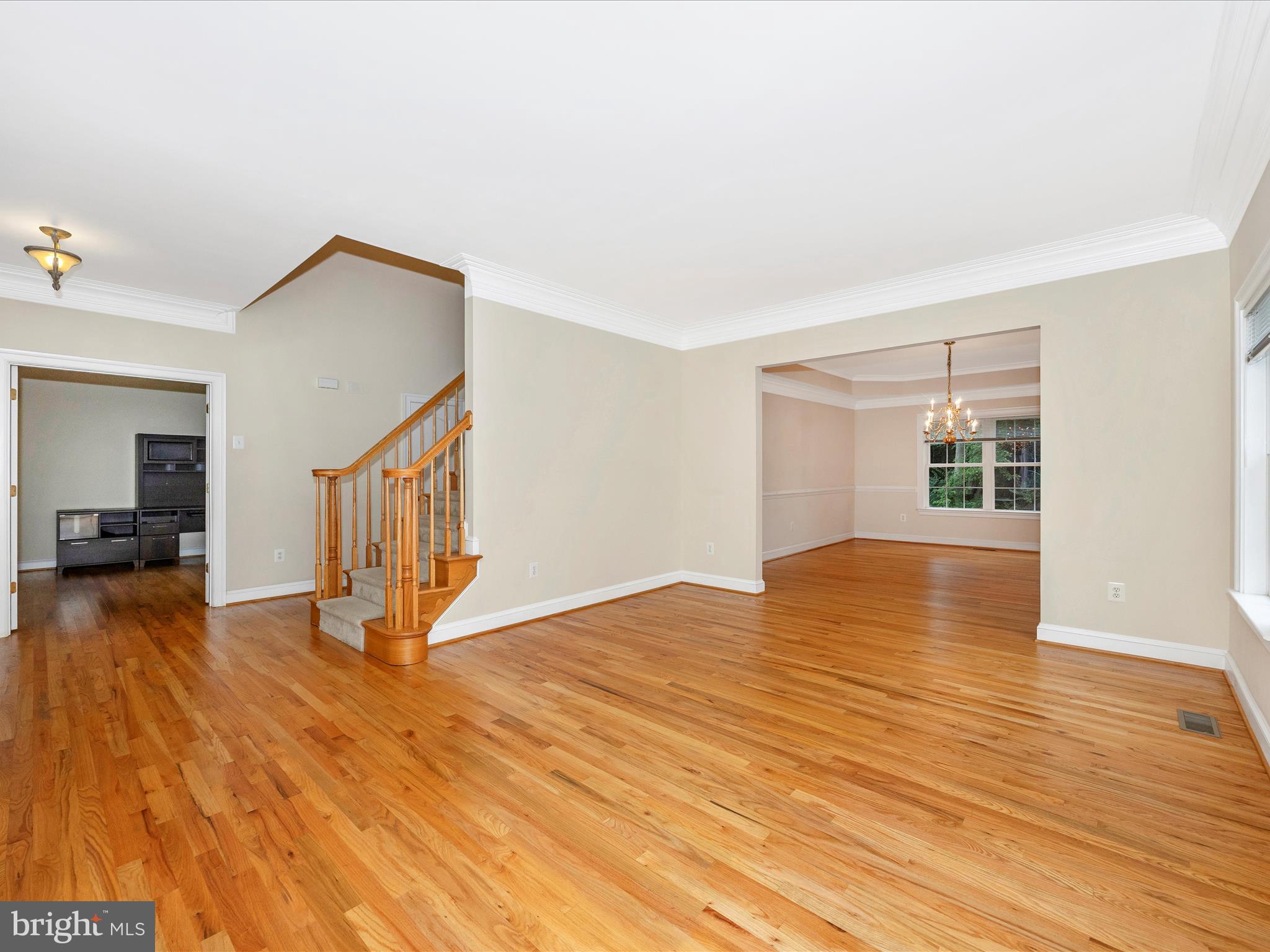 18818 Liberty Mill Road Germantown, MD 20874 - Photo 5 of 39 a view of an empty room with wooden floor and a window