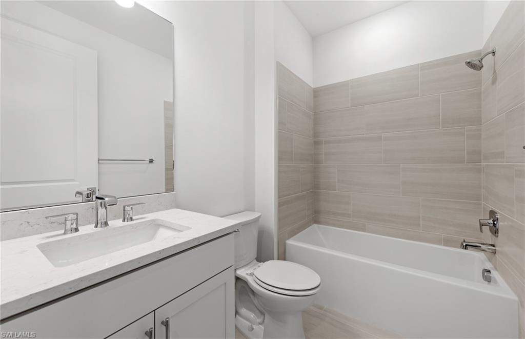 15779 Northridge Road Punta Gorda, FL 33982 - Photo 17 of 24 a bathroom with a sink a toilet and bathtub