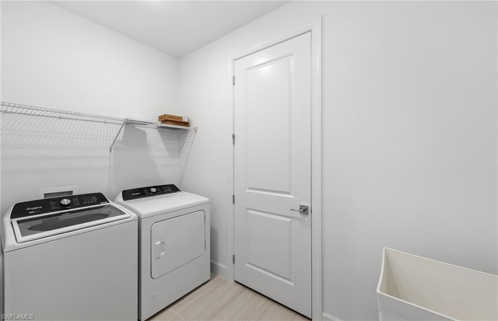 15779 Northridge Road Punta Gorda, FL 33982 - Photo 18 of 24 a utility room with dryer and washer