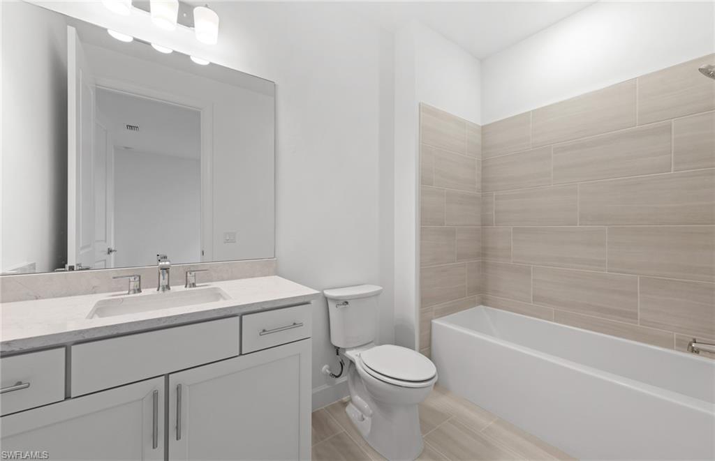 15779 Northridge Road Punta Gorda, FL 33982 - Photo 19 of 24 a bathroom with a sink a toilet and shower