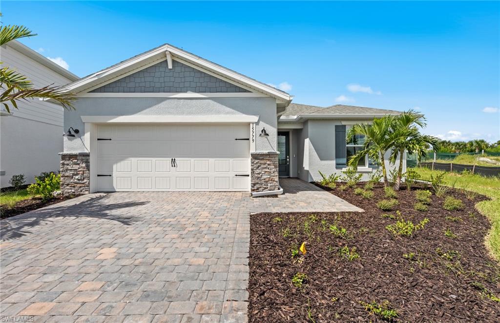 15779 Northridge Road Punta Gorda, FL 33982 - Photo 22 of 24 a front view of a house with a yard