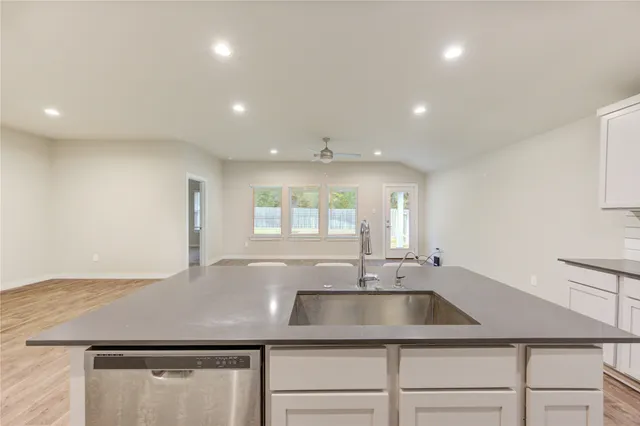 a kitchen with a sink and a window