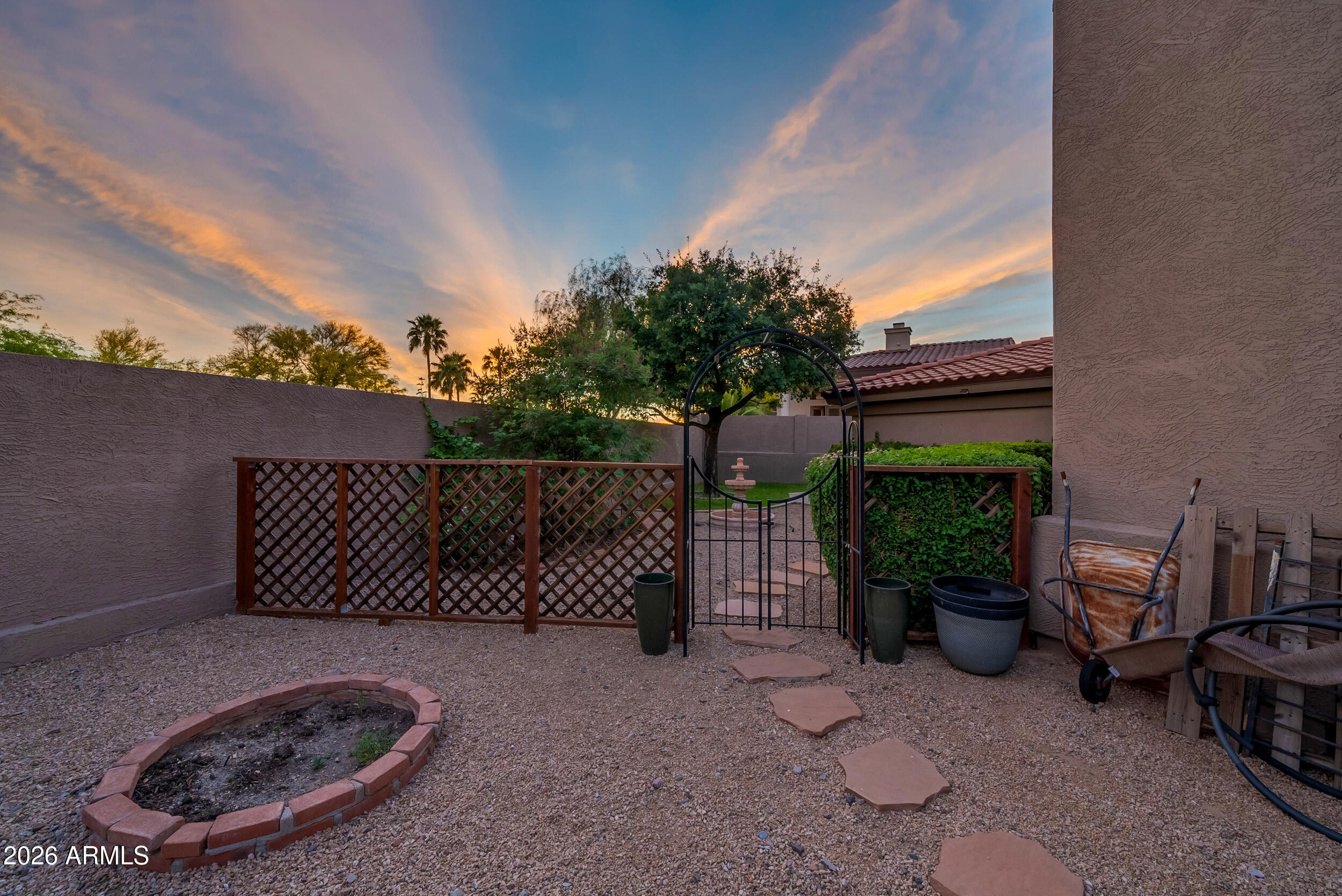 1539 East Winged Foot Road Phoenix, AZ 85022 - Photo 54 of 64 a view of a backyard with plants and a patio