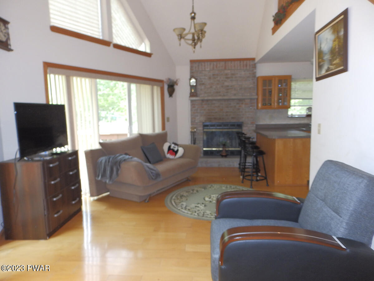 186 Skyview Road Dingmans Ferry, PA 18328 - Photo 9 of 33 a living room with furniture and a flat screen tv