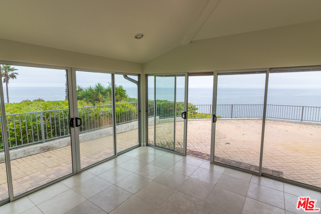 20534 Roca Chica Drive Malibu, CA 90265 - Photo 12 of 38 a view of an empty room and window