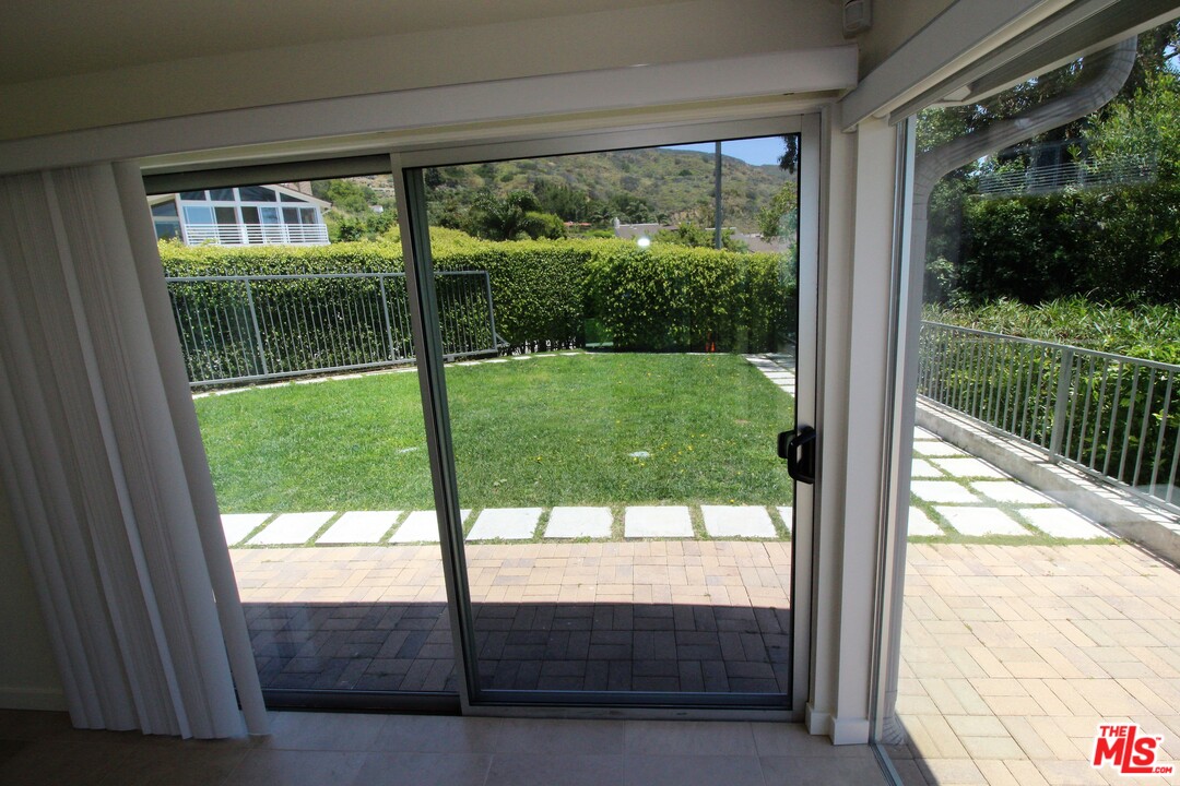 20534 Roca Chica Drive Malibu, CA 90265 - Photo 13 of 38 a view of backyard from a window
