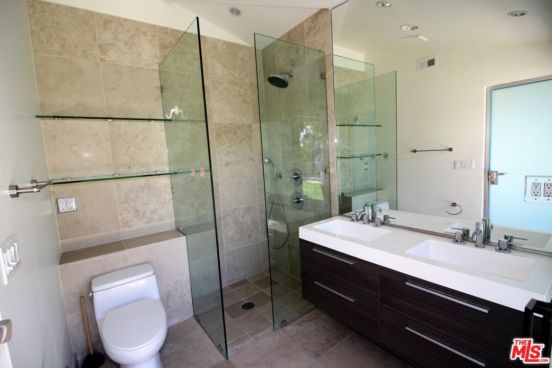 20534 Roca Chica Drive Malibu, CA 90265 - Photo 14 of 38 a bathroom with a sink toilet and shower