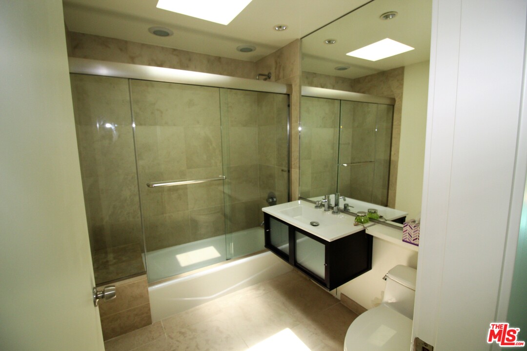 20534 Roca Chica Drive Malibu, CA 90265 - Photo 15 of 38 a bathroom with a sink a toilet and shower