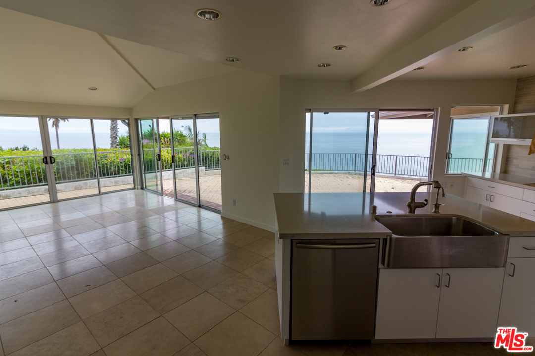 20534 Roca Chica Drive Malibu, CA 90265 - Photo 19 of 38 a living room with furniture and large windows