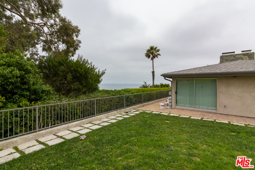 20534 Roca Chica Drive Malibu, CA 90265 - Photo 23 of 38 a view of a garden with a lake view