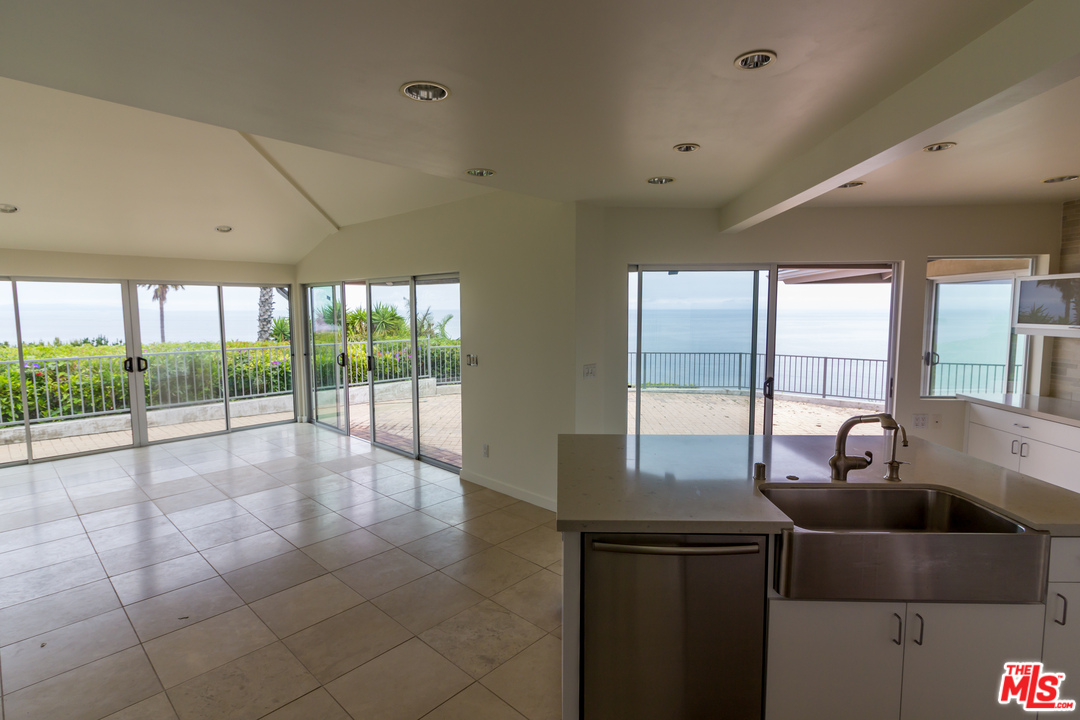 20534 Roca Chica Drive Malibu, CA 90265 - Photo 29 of 38 a view of a big room with windows and chandelier