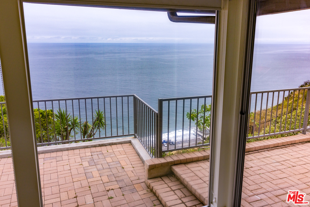 20534 Roca Chica Drive Malibu, CA 90265 - Photo 30 of 38 a view of a balcony with a swing