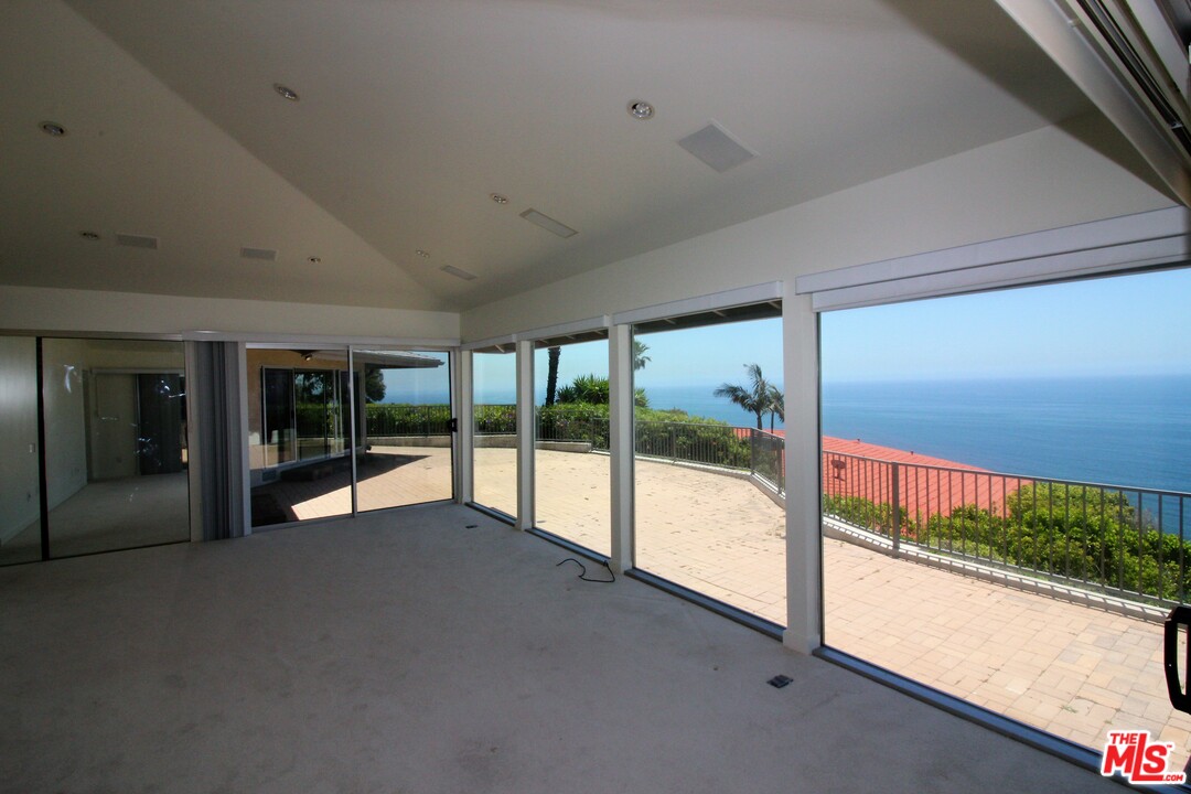 20534 Roca Chica Drive Malibu, CA 90265 - Photo 4 of 38 a view of an empty room with a floor to ceiling window