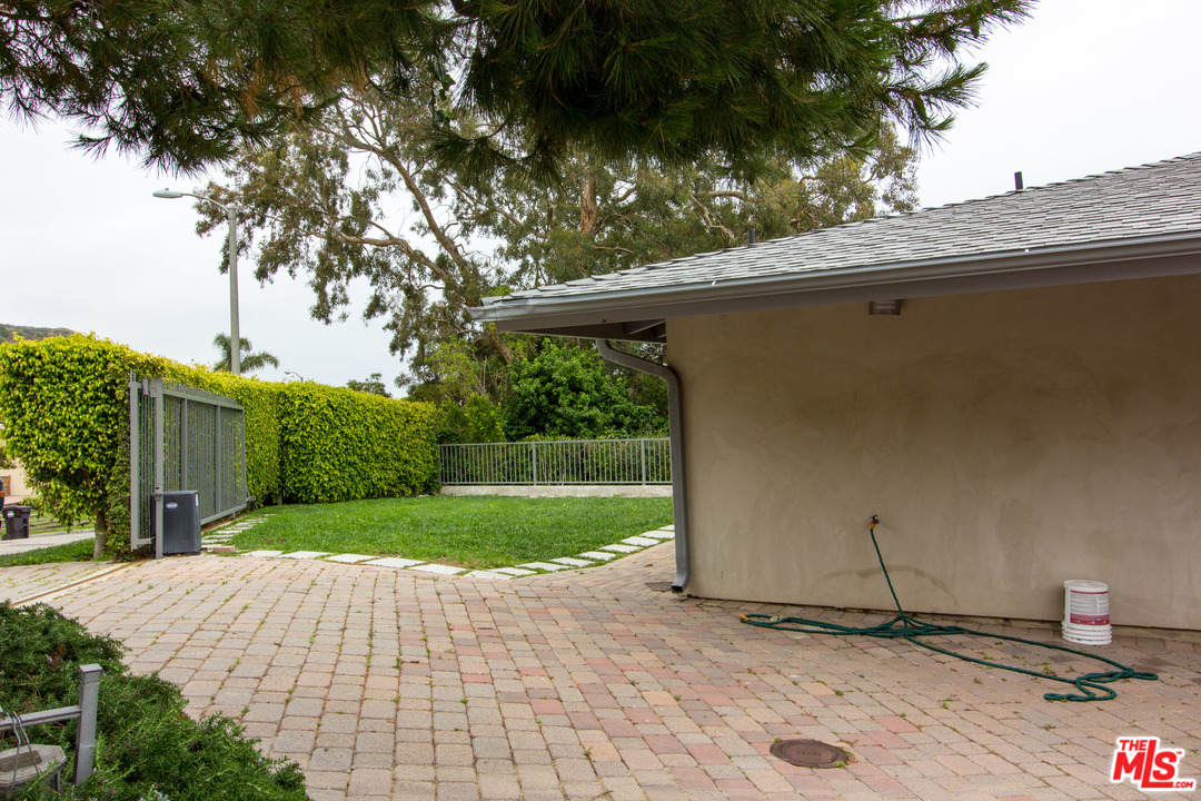 20534 Roca Chica Drive Malibu, CA 90265 - Photo 34 of 38 a backyard of a house with lots of green space