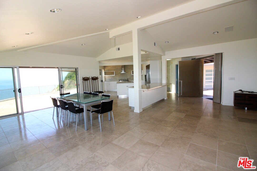 20534 Roca Chica Drive Malibu, CA 90265 - Photo 7 of 38 a dining room with furniture and wooden floor