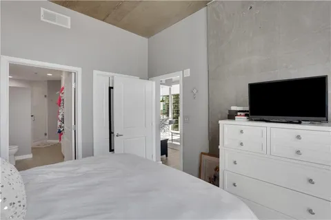 a bathroom with a double vanity sink mirror and toilet