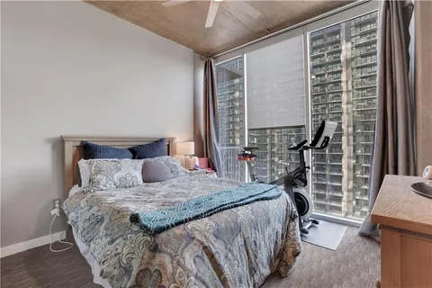 a bedroom with a large bed and a window