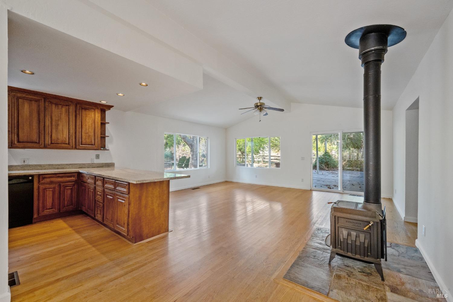 1350 Wooden Valley Road Napa, CA 94558 - Photo 3 of 6 a view of a kitchen with kitchen island wooden floor and window