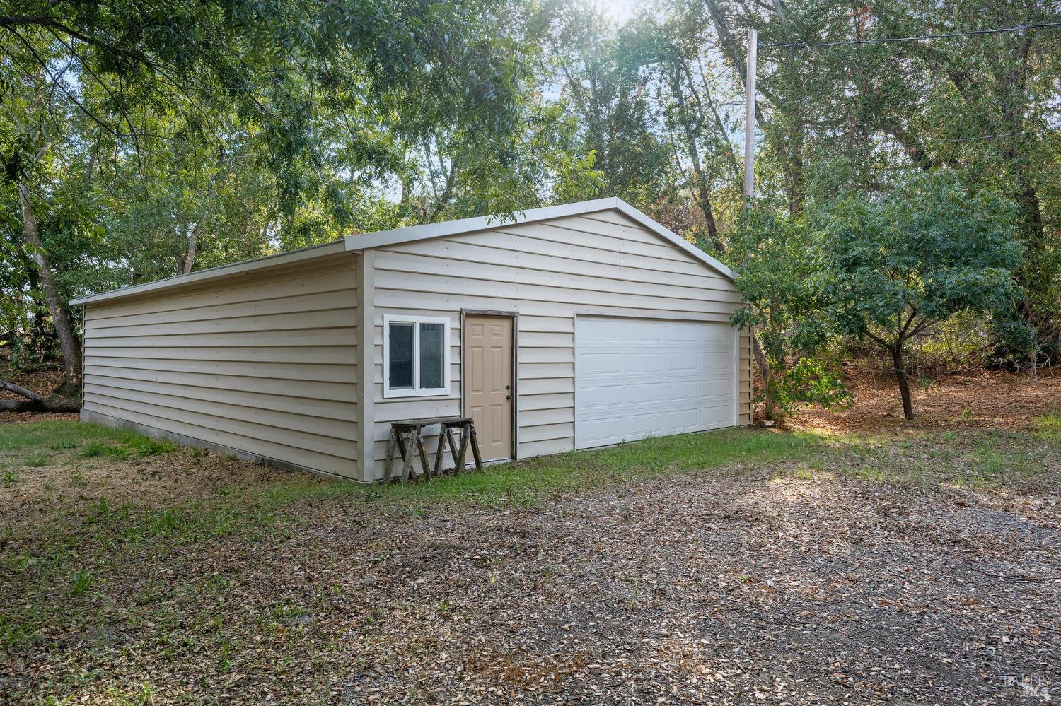 1350 Wooden Valley Road Napa, CA 94558 - Photo 6 of 6 a view of a house with a yard and large tree