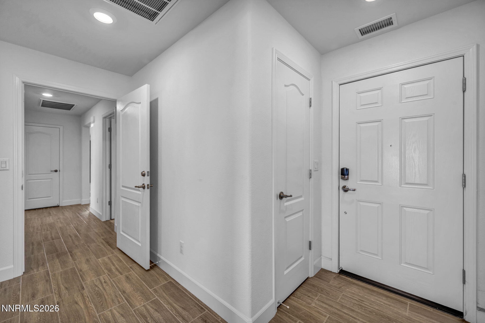 7181 Saddlehorn Road Carson City, NV 89701 - Photo 45 of 62 a view of a hallway with wooden floor