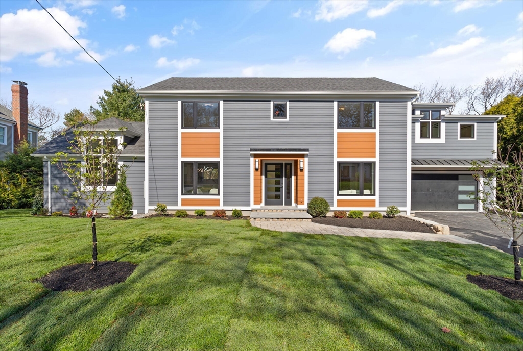 a front view of a house with a yard