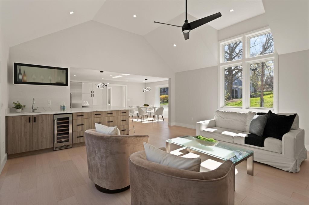 21 Richard Road Lexington, MA 02421 - Photo 11 of 34 a living room with furniture and kitchen view