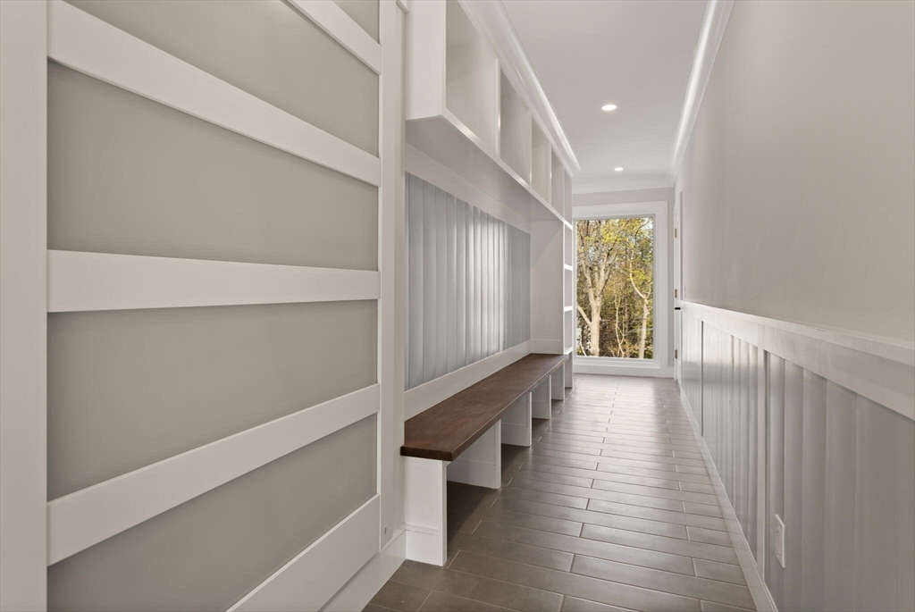 21 Richard Road Lexington, MA 02421 - Photo 18 of 34 a view of a hallway with wooden floor and staircase