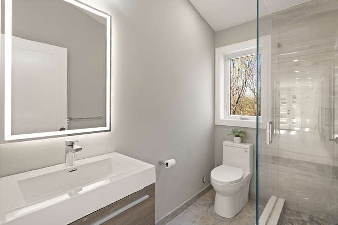 21 Richard Road Lexington, MA 02421 - Photo 19 of 34 a bathroom with a sink a toilet and shower