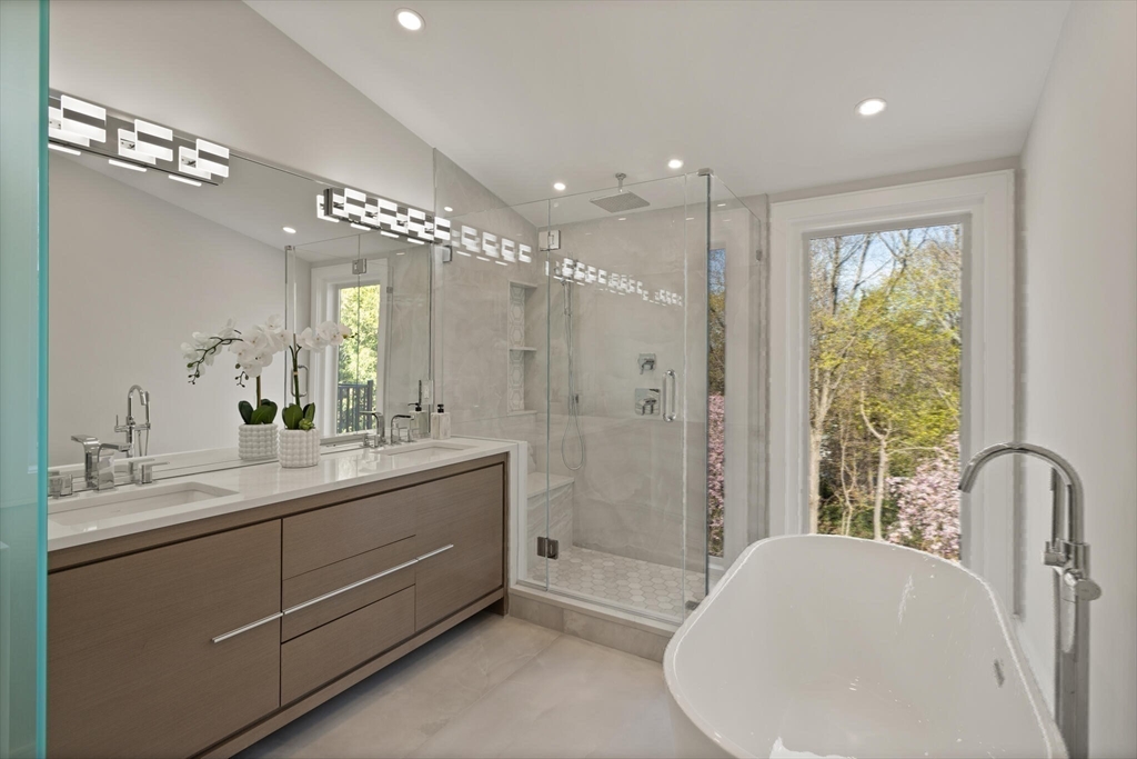 21 Richard Road Lexington, MA 02421 - Photo 22 of 34 a bathroom with a double vanity sink toilet and shower