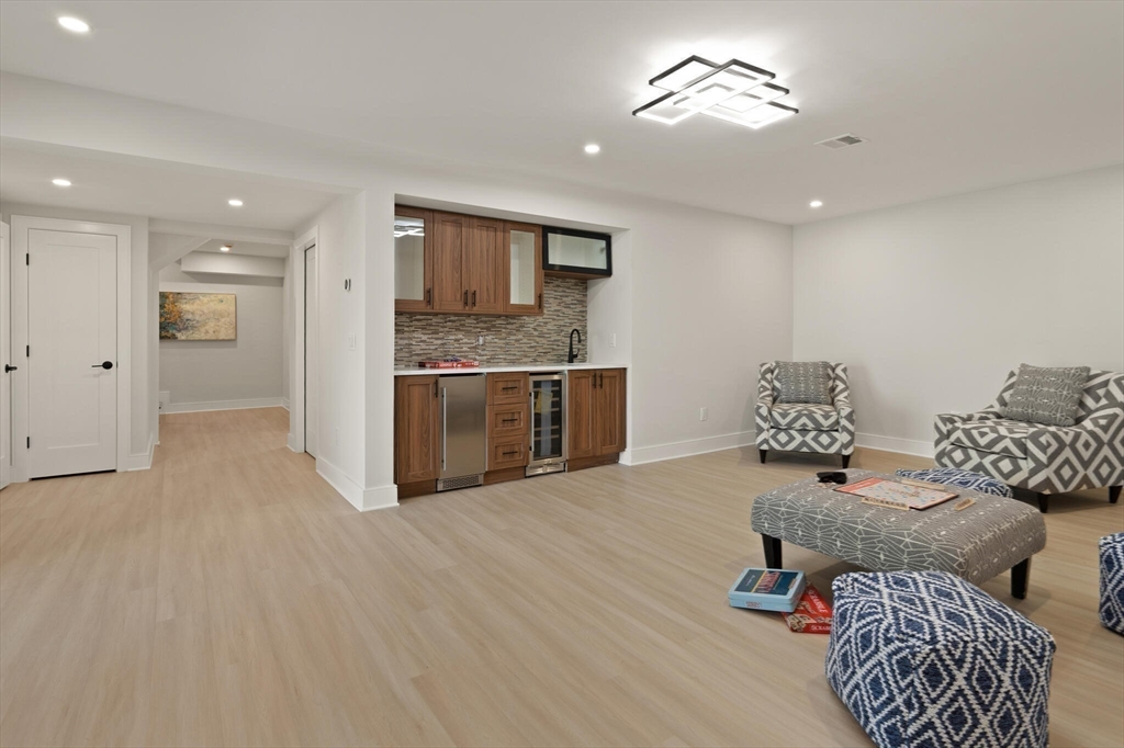 21 Richard Road Lexington, MA 02421 - Photo 28 of 34 a living room with furniture and a fireplace