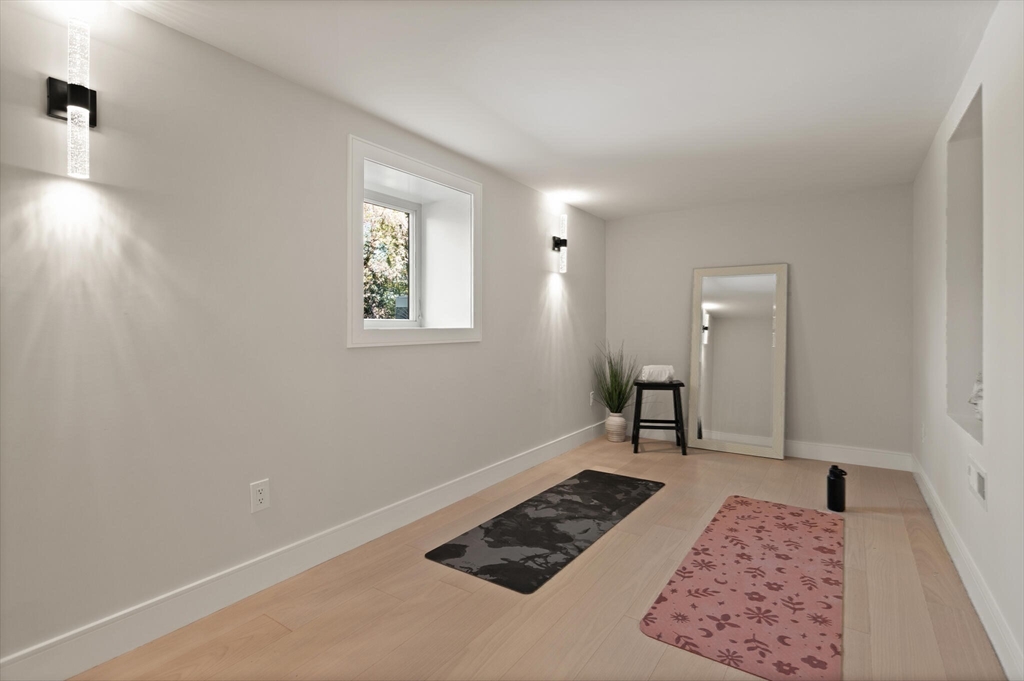 21 Richard Road Lexington, MA 02421 - Photo 31 of 34 a bedroom with a bed and a window