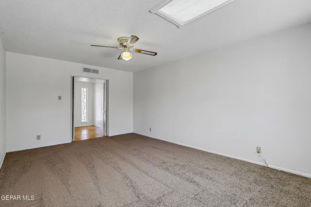 a kitchen with stainless steel appliances granite countertop a stove and a refrigerator