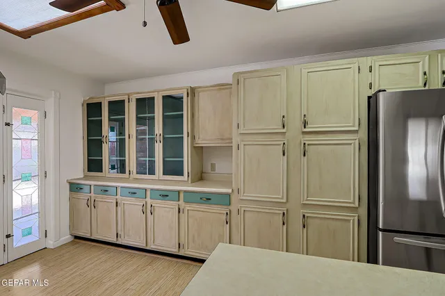 a kitchen with a sink cabinets and window