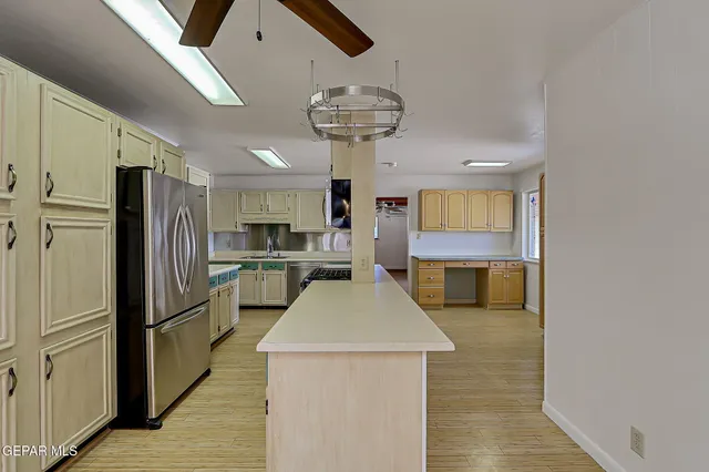 a kitchen that has a sink and a stove
