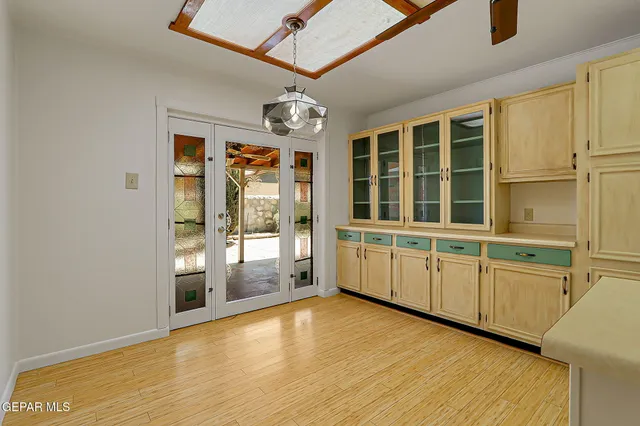 a bedroom with a bed and a potted plant