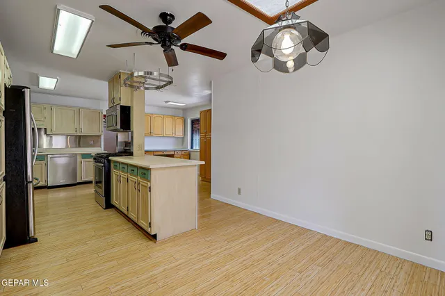 a bedroom with a bed and a potted plant