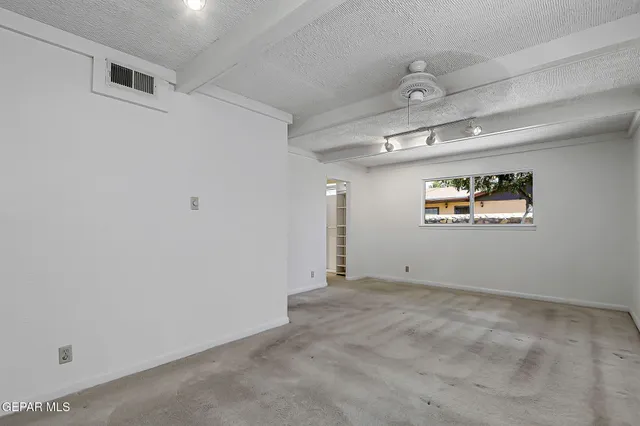 an aerial view of residential house with outdoor space and seating area