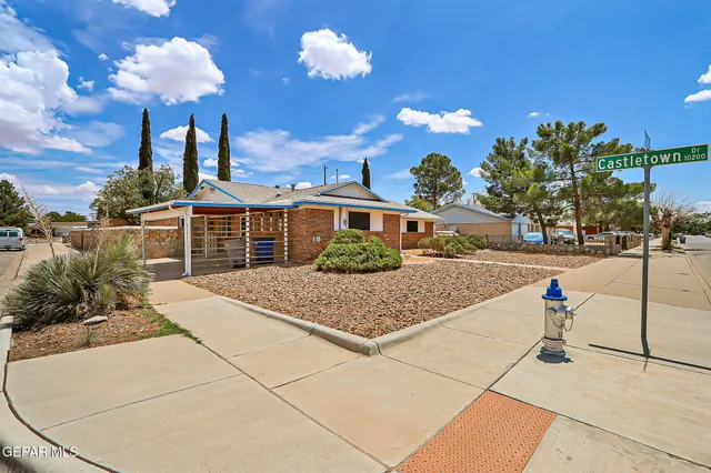 a front view of a house with street view