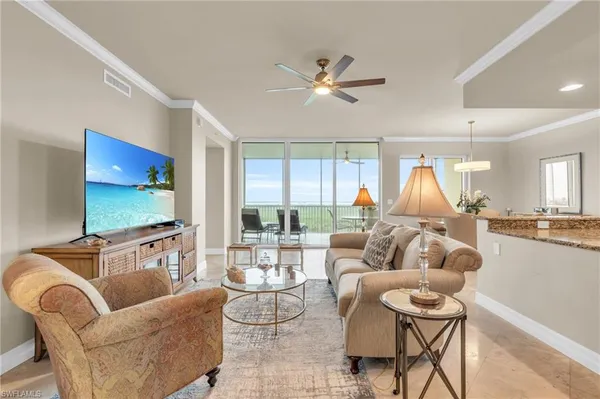 a living room with fireplace furniture and a flat screen tv