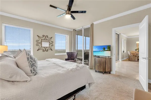 a bed room with a bed and a television