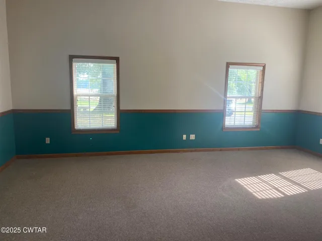 an empty room with windows