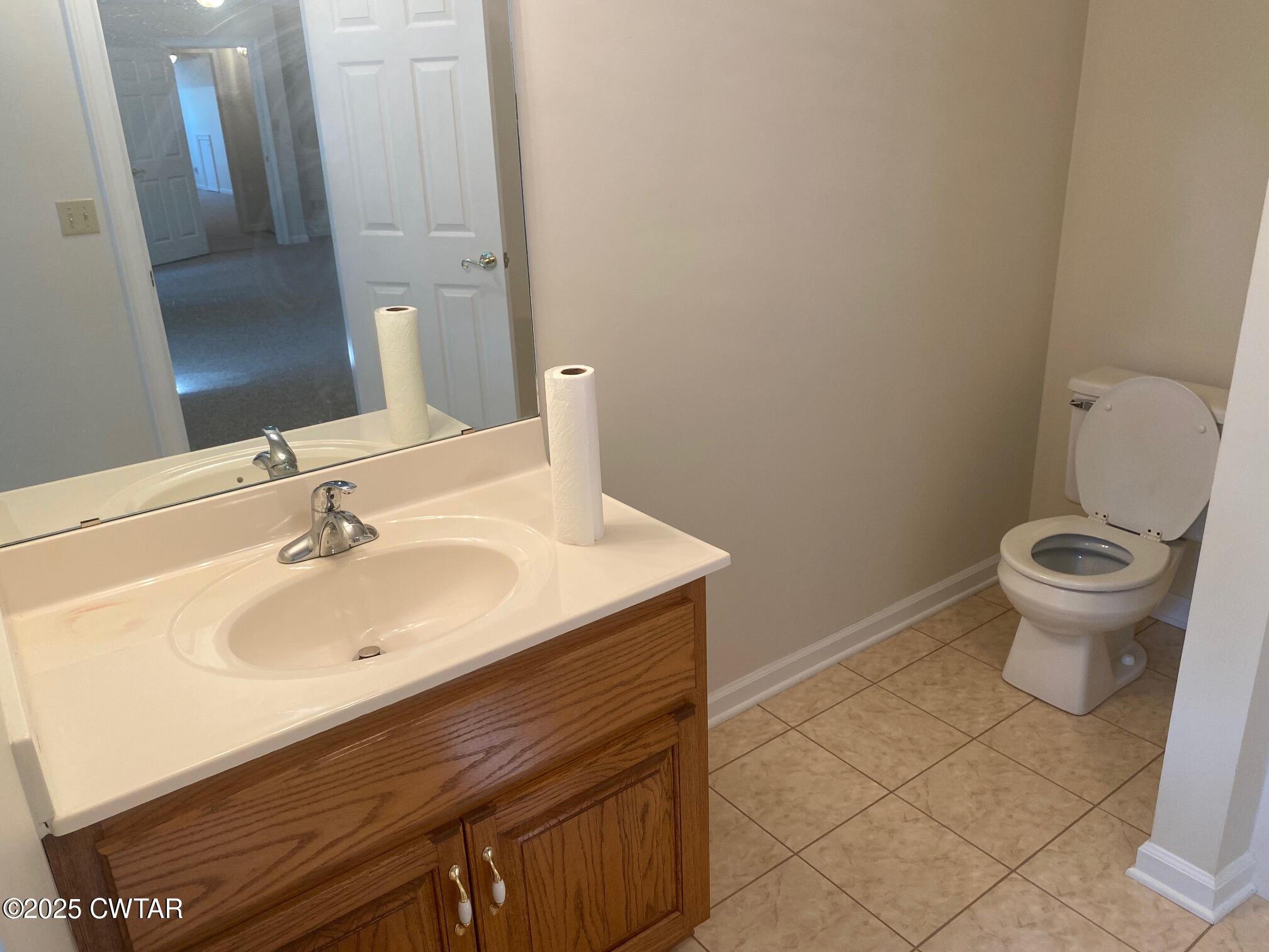 465 Garland Road Henderson, TN 38340 - Photo 23 of 31 a bathroom with a sink and a toilet
