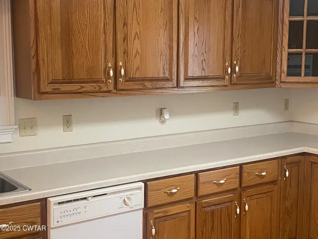 a view of cabinets with wooden floor
