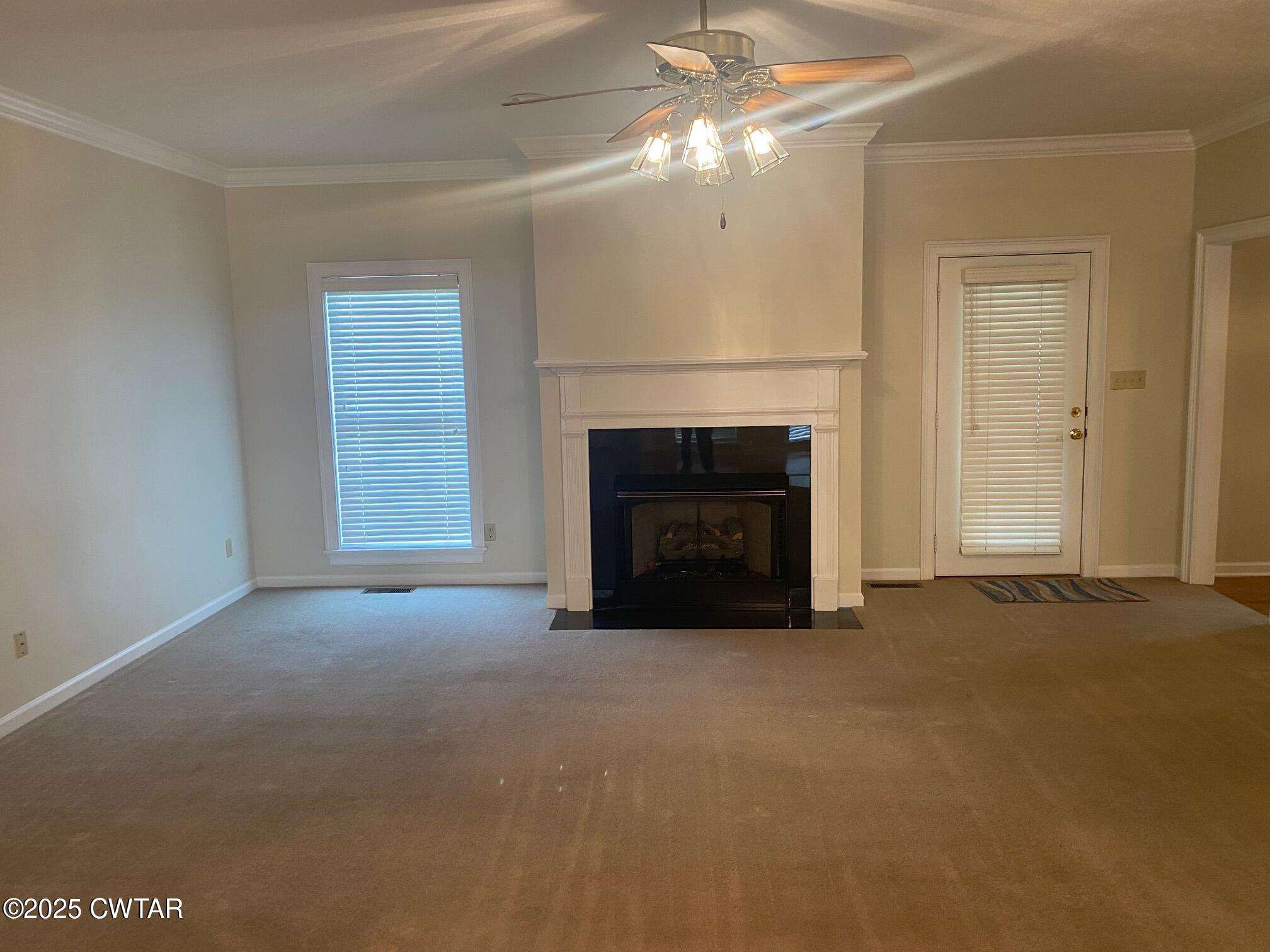465 Garland Road Henderson, TN 38340 - Photo 5 of 31 a view of empty room with a fireplace