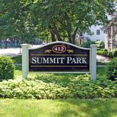 a sign broad in front of flowers