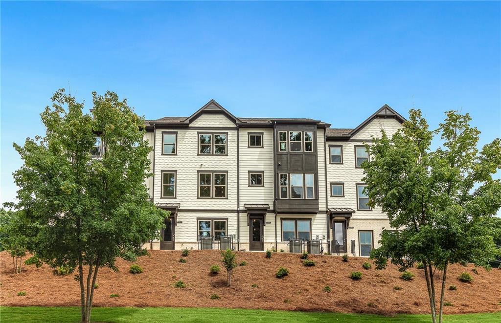 1086 Patterson Park Road Decatur, GA 30033 - Photo 1 of 1 a front view of a residential apartment building with a yard