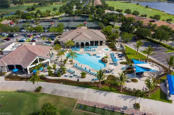 an aerial view of multiple houses with yard